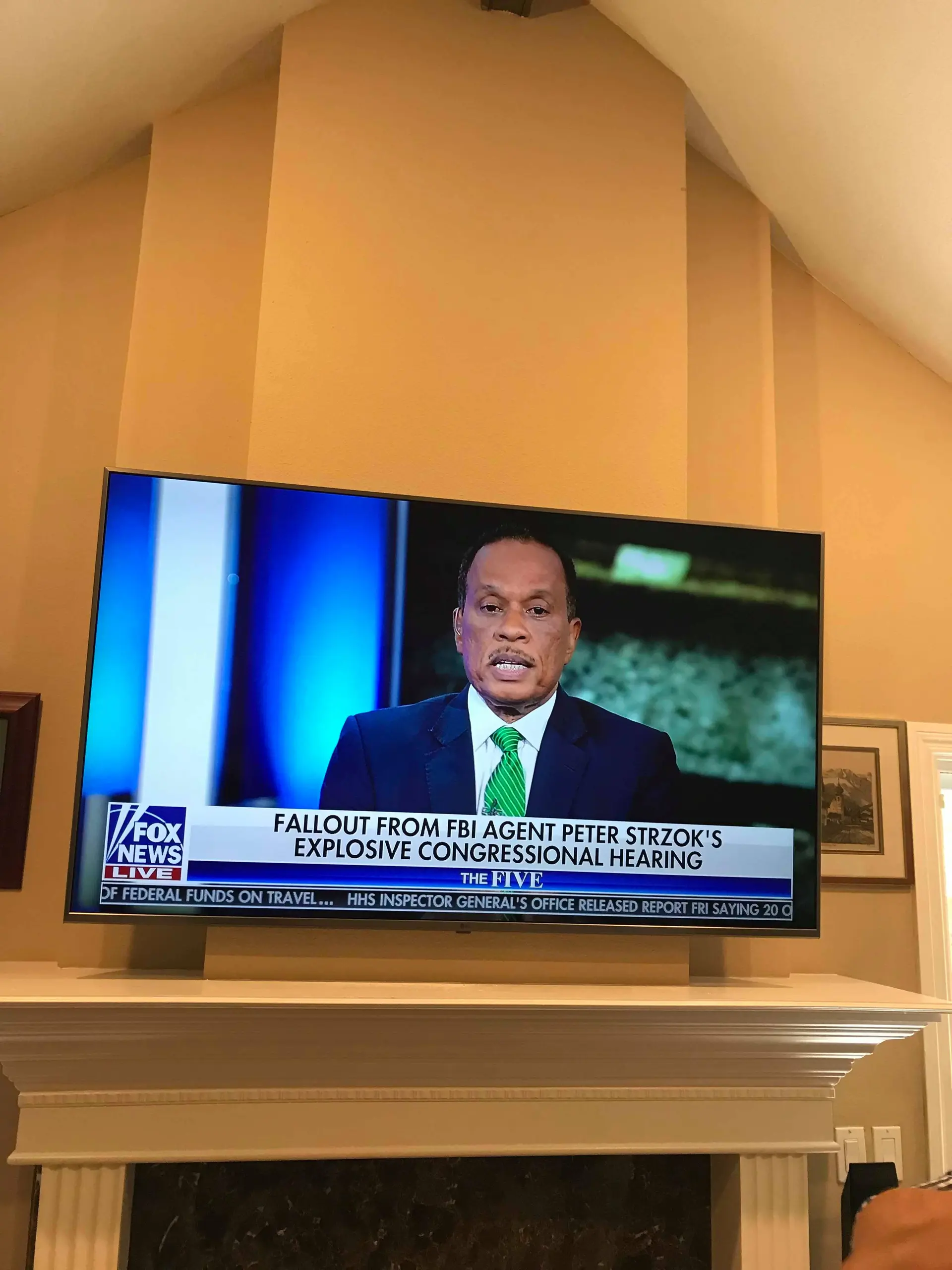 Full motion TV bracket mounted on drywall in Inland Empire home