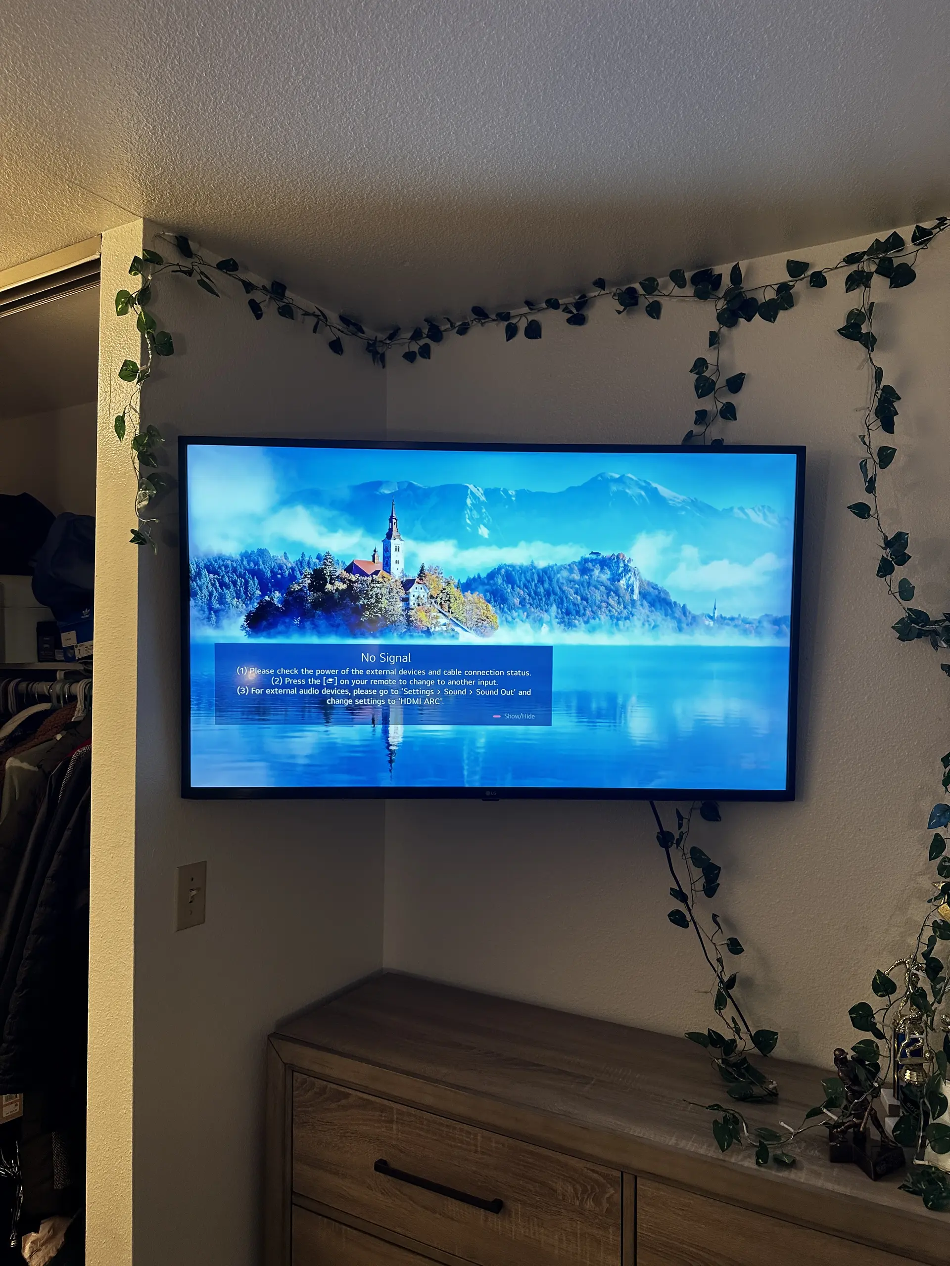 Professional TV mount above fireplace with hidden wires